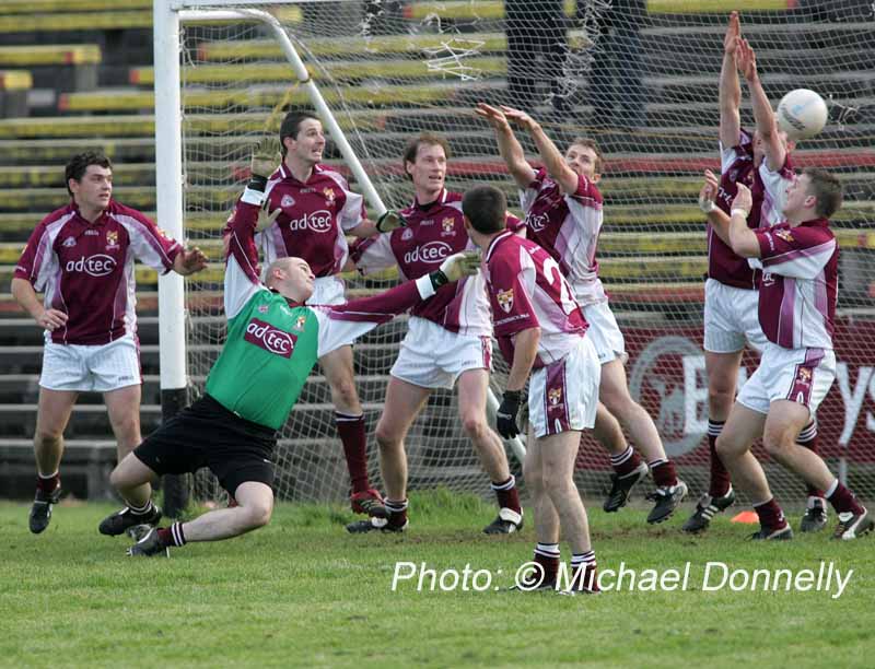 Crossmolina defenders see this ball heading to the back of their net in the Lynch Breaffy House Hotel and Spa County Senior Football Final Replay in McHale Park Castlebar. Photo:  Michael Donnelly