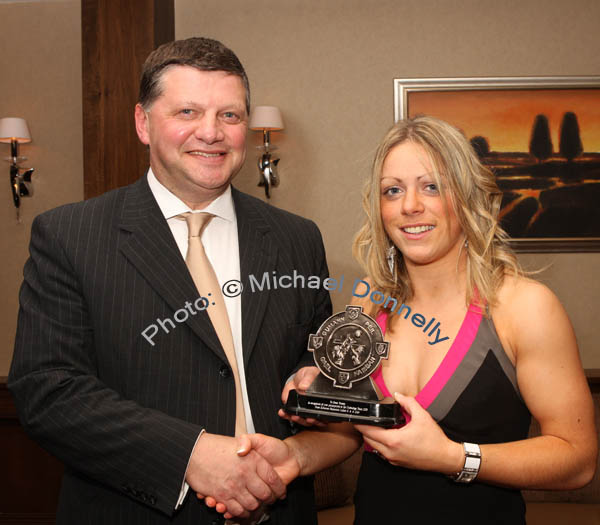 John O'Mahony makes a presentation to Emer Tansey in recognition of her participation in the Underdogs team 2008 at the Kilmovee Shamrocks Ladies Gaelic Football Club annual Dinner in The Abbeyfield Hotel, Ballaghaderreen. Photo:  Michael Donnelly