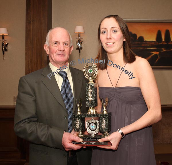 John Towey presents the "Young Player of the Year" award to Michelle Kelly, at the Kilmovee Shamrocks Ladies Gaelic Football Club annual Dinner in The Abbeyfield Hotel Ballaghaderreeen. Photo:  Michael Donnelly