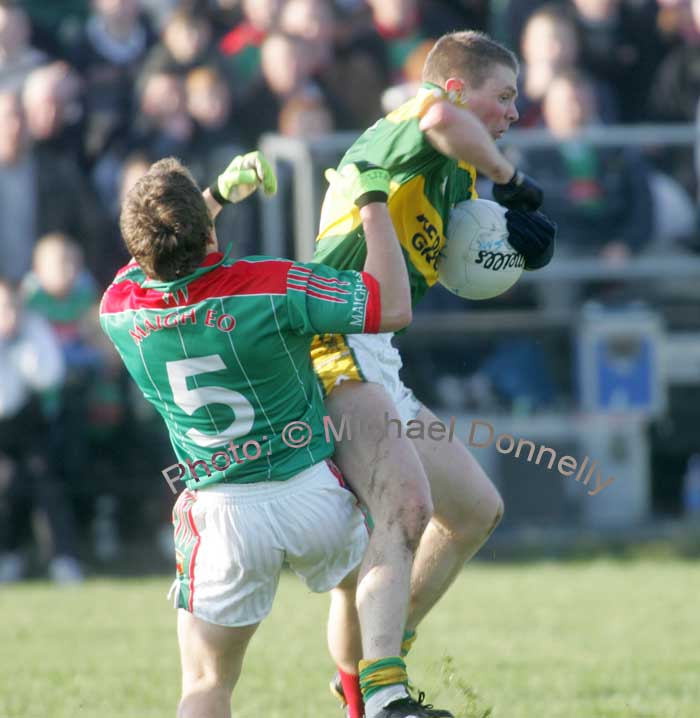 Andy Moran gets the "Elbow Treatment" in the 1st round of the Allianz National Football League between Mayo and Kerry, at McHale Park last Sunday. Photo:  Michael Donnelly