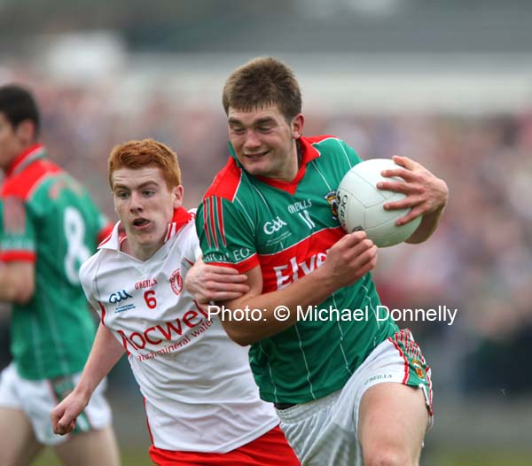 Tyrone's Peter Harte tries to hang on to Aiden O'Shea at the ESB All Ireland Minor Football Final replay in Pearse Park, Longford.Photo: � Michael Donnelly