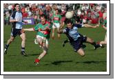 James Nallen lets fly against Dublin despite the challenge of  Darren Magee in the 2007 Allianz National Football League Div 1A round 6 in McHale Park Castlebar. Photo:  Michael Donnelly