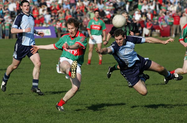 James Nallen lets fly against Dublin despite the challenge of  Darren Magee in the 2007 Allianz National Football League Div 1A round 6 in McHale Park Castlebar. Photo:  Michael Donnelly