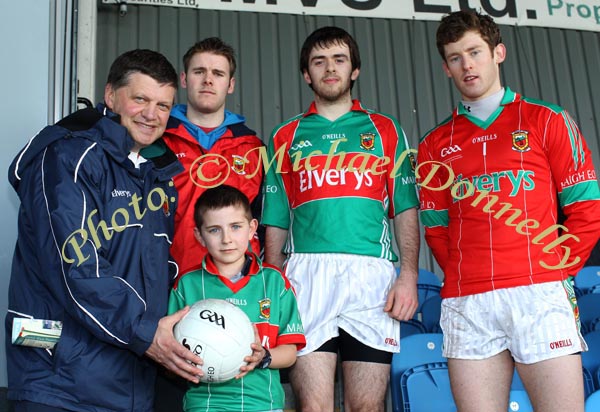 Donal Rowe, Ballyvary National School is presented with a Football by Mayo Senior Team manager John O'Mahony  at the Mayo v Dublin match in the Allianz GAA Football National League Division 1 Round 3 in McHale Park, Castlebar, Included in photo are  Mayo players  Aiden Kilcoyne, Kevin McLoughlin and David Clarke. Photo:  Michael Donnelly