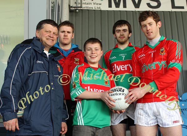 Tom Dawson, Sancta Maria College Louisburgh is presented with a Football by Mayo  goalkeeper David Carke, at the Allianz GAA Football National League Division 1 Round 3 in McHale Park, Castlebar, included in photo are Mayo Senior Team manager John O'Mahony, Aidan Kilcoyne and Kevin MacLoughlin.Photo:  Michael Donnelly