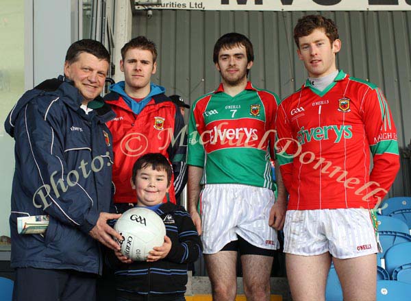 Darren Moffatt, Glencorrib National School is presented with a Football by Mayo Senior Team manager John O'Mahony at the Allianz GAA Football National League Division 1 Round 3 in McHale Park, Castlebar, included in photo are Aiden Kilcoyne, Kevin McLoughlin and David Clarke. Photo:  Michael Donnelly