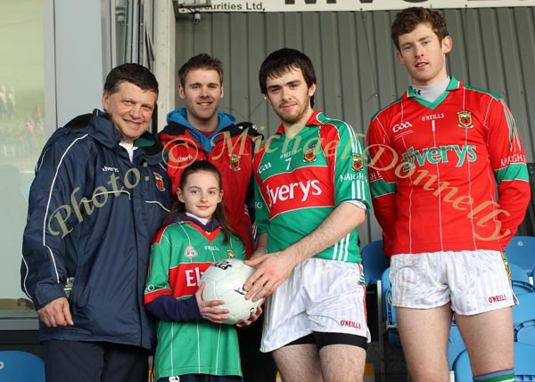 Alisha Conway, St Peters  National School, Snugboro is presented with a Football by Kevin McLoughlin at the Allianz GAA Football National League Division 1 Round 3 in McHale Park, Castlebar, included in photo are Mayo Senior Team manager John O'Mahony, Aidan Kilcoyne and David Clarke. Photo:  Michael Donnelly