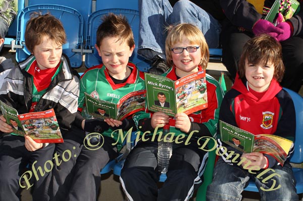 Checking the  programme lineout at the Allianz GAA Football National League Division 1 Round 3 in McHale Park, Castlebar on Sunday last were from left: Conal & Patrick Caulfield, Darragh Healy and  Joshua Webb, Ballyhaunis. Photo:  Michael Donnelly