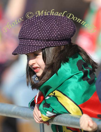 This young Mayo supporter used her flag as an extra layer of clothes at the Allianz GAA Football National League Division 1 Round 3 in McHale Park, Castlebar. Photo:  Michael Donnelly