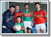 Donal Rowe, Ballyvary National School is presented with a Football by Mayo Senior Team manager John O'Mahony  at the Mayo v Dublin match in the Allianz GAA Football National League Division 1 Round 3 in McHale Park, Castlebar, Included in photo are  Mayo players  Aiden Kilcoyne, Kevin McLoughlin and David Clarke. Photo:  Michael Donnelly