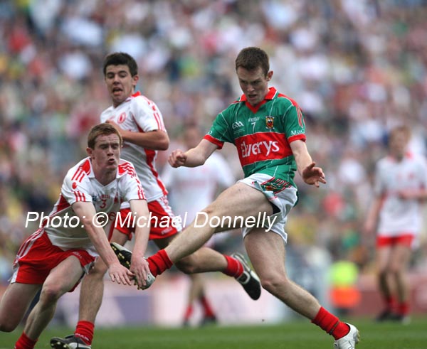 Mayo captain Shane Nally gets his shot in against Tyrone's  Gavin Teague in the ESB GAA All Ireland Minor Football Final in Croke Park. Photo:  Michael Donnelly