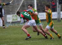 Cillian O'Connor battling with theMark McHugh in the Donegal defence at the 2013 Allianz Football League Div 1 Round 6 in Elverys MacHale Park Castlebar. Photo: © Michael Donnelly