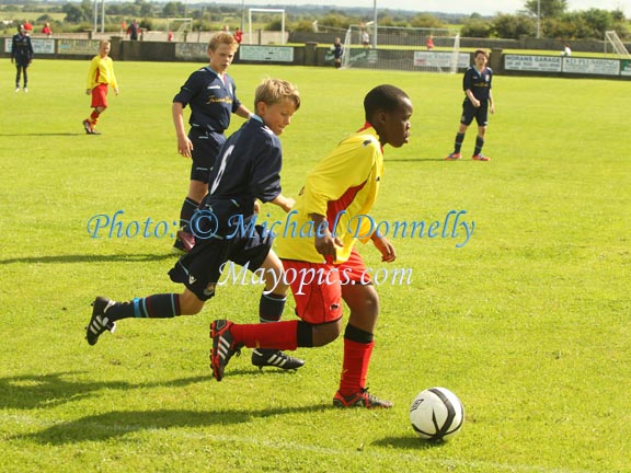 West Ham's Mason Barrett keeps an eye on Watford's Jadon Sancho  at Ballyglass in Mayo International Cup. Jadon won the Golden Boot award for the Tournament. Photo: © Michael Donnelly Photography