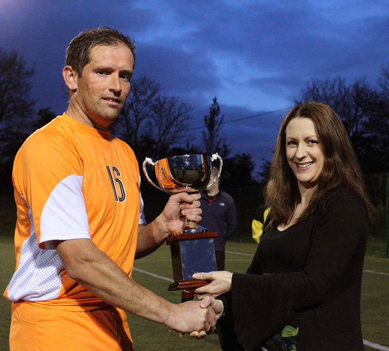 Sharon Kelleher  presents the Oliver Kelleher Masters Cup to Stephen Barrett, captain Mulranny Utd,  after defeating Ballinrobe Town in the inaugural Oliver Kelleher Masters Cup final  for 2011 at Milebush Park. Photo:Michael Donnelly.