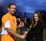 Sharon Kelleher  presents the Oliver Kelleher Masters Cup to Stephen Barrett, captain Mulranny Utd,  after defeating Ballinrobe Town in the inaugural Oliver Kelleher Masters Cup final  for 2011 at Milebush Park. Photo:Michael Donnelly.