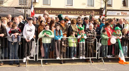 Crowds wait for the nest Float at the Claremorris St Patrick's Day Parade. Photo:  Michael Donnelly