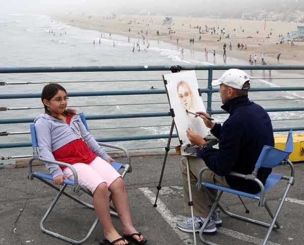 Artist at work on Santa Monica Pier, California. Photo Michael Donnelly