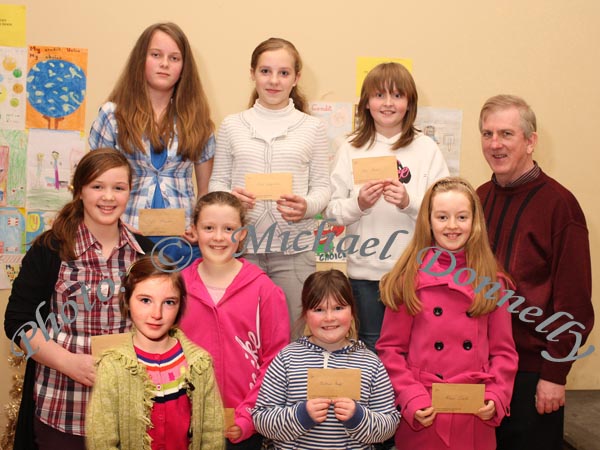 Winners in the Convent of Mercy Primary School Claremorris section of the St Colmans (Claremorris) Credit Union Poster Competition, held in the Dalton Inn Hotel, Claremorris, front from left: Category A- Orla O'Brien, 1st; Christina Burke, 2nd;  middle row Category B: Kelsey Morley, 1st; Aoife Clarke, 2nd; Niamh Costello, 3rd;  At back Category C: Angela Stowinska, 1st; Inga Juozunaite, 2nd; Ruth Hughes, 3rd; included in photo is Seamus Connaughton, Claremorris Credit Union. Photo Michael Donnelly 