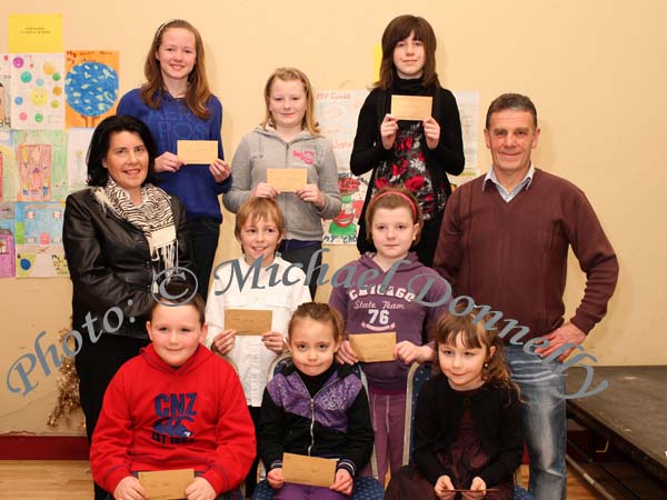 Winners in the Lehinch National School section of the St Colmans (Claremorris) Credit Union Poster Competition, held in the Dalton Inn Hotel, Claremorris, front from left: Category A- Mark Kelly 1st; Caoimhe Hughes, 2nd; Niamh Cassidy, 3rd; middle row Category B: Harry Delaney, 1st; Megan McDermott 2nd; Missing was Kayleen Coen, 3rd;  At back: Category C: Louise Delaney, 1st; Rebecca McDermott, 2nd; and Hannah Coleman, 3rd; Included in photo are Catherine Owens, teacher and John Timothy, Claremorris Credit Union. Photo Michael Donnelly 