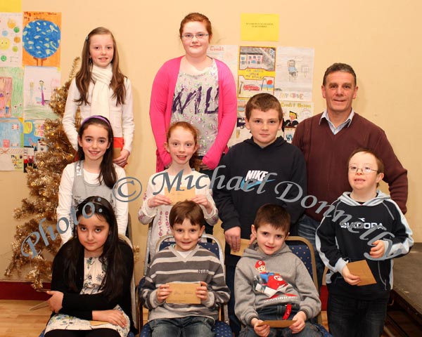 Winners in the Barnacarroll National School section of the St Colmans (Claremorris) Credit Union Poster Competition, held in the Dalton Inn Hotel, Claremorris, front from left: Category A - Louise Keane Reaney, 1st; Ethan Breslin, 2nd; Paul Flatley 3rd; middle row Category B: Sinead O'Brien, 1st; Aoife Carney, 2nd; Paul Flatley, 3rd;  At back: Category C: Kaytlyn Reaney, 1st; Mairead Salmon, 2nd (missing); and Orla Flatley, 3rd; Included in photo is John Timothy, Claremorris Credit Union. Photo Michael Donnelly
