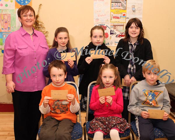 Winners in the Roundfort National School section of the St Colmans (Claremorris) Credit Union Poster Competition, held in the Dalton Inn Hotel, Claremorris, front from left: Category A- Eoin Connelly, 1st; Shauna McHugh, 2nd; Sean Hession, 3rd;  At Back - Martina Gormley, Claremorris Credit Union pictured with Category B winners: Orla Henry, 1st; missing was Hannah Connolly, 2nd;  Shauna Connell was 3rd; In Category C:  Megan Thornton (on right), was 3rd; Missing were Sean Ferriter 1st and Alison McDonald, 2nd, in Cat C. Photo Michael Donnelly 