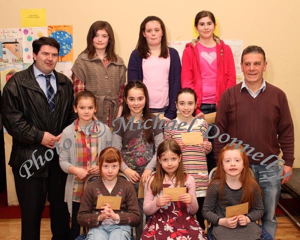 Winners in the Meelickmore National School section of the St Colmans (Claremorris) Credit Union Poster Competition, held in the Dalton Inn Hotel, Claremorris, front from left: Category A- Emer O'Neill, 1st; Aishling Cunniffe, 2nd; Laoise Kelly, 3rd; middle row Category B: Annemarie Kelly, 1st; Tianna Maher,  2nd; Leanne O'Boyle, 3rd; At back: Category C; Chantelle Higgins, 1st; Sadhbh Stapleton, 2nd; and Claire Naughton, 3rd; Included in photo are Liam Horkan, principal,  and John Timothy, Claremorris Credit Union. Photo Michael Donnelly  
