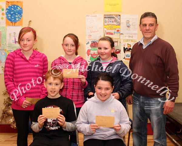 Winners in the Taugheen National School section of the St Colmans (Claremorris) Credit Union Poster Competition, held in the Dalton Inn Hotel, Claremorris, front from left: Category B - Alan Campbell 2nd;  and Kelly Finn, 3rd;  At back: Category C: Amy Colleran, 1st; Joanne Burke, 2nd; and Noelle Burke, 3rd; Included in photo is John Timothy, Claremorris Credit Union.  Missing was Thomas Morris Cat B 1st. Photo Michael Donnelly