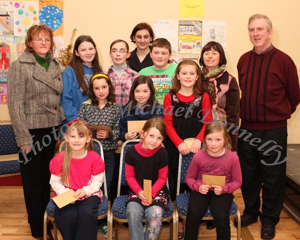 Winners in the Gaelscoil Uileig De Burca section of the St Colmans (Claremorris) Credit Union Poster Competition, held in the Dalton Inn Hotel, Claremorris, front from left: Category A- Alanah McDonagh, 1st; Aisling N hOrcain, 2nd; Lara Finnerty, 3rd; middle row Category B: Abaigeal Burns, 1st; Grace Nolan,  2nd; Gillian N Fhloinn, 3rd; At back: Category C; Shania McDonagh, 1st; Lisa McGuire, 2nd; and Daniel Mooney, 3rd; Included in photo are Maire N  Shlogl, Marie N Mhurch, Carol U hOrcain and Seamus Connaughton, Claremorris Credit Union. Photo Michael Donnelly  
