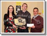 Keelan McNamara, St Colman's College, Claremorris, the Overall winner of the St Colman's (Claremorris) Credit Union Poster Competition 2009 is presented with the Gerry Rynne Memorial Trophy by Gerry's grandaughter Laura Hanley,  while John Timothy, Claremorris Credit Union presents him with his prizemoney;In the background is Keelan's winning poster. Photo:  Michael Donnelly