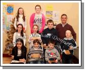 Winners in the Barnacarroll National School section of the St Colmans (Claremorris) Credit Union Poster Competition, held in the Dalton Inn Hotel, Claremorris, front from left: Category A - Louise Keane Reaney, 1st; Ethan Breslin, 2nd; Paul Flatley 3rd; middle row Category B: Sinead O'Brien, 1st; Aoife Carney, 2nd; Paul Flatley, 3rd;  At back: Category C: Kaytlyn Reaney, 1st; Mairead Salmon, 2nd (missing); and Orla Flatley, 3rd; Included in photo is John Timothy, Claremorris Credit Union. Photo Michael Donnelly