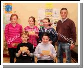 Winners in the Taugheen National School section of the St Colmans (Claremorris) Credit Union Poster Competition, held in the Dalton Inn Hotel, Claremorris, front from left: Category B - Alan Campbell 2nd;  and Kelly Finn, 3rd;  At back: Category C: Amy Colleran, 1st; Joanne Burke, 2nd; and Noelle Burke, 3rd; Included in photo is John Timothy, Claremorris Credit Union.  Missing was Thomas Morris Cat B 1st. Photo Michael Donnelly