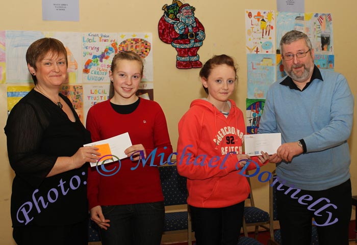Inga Jouzunaite and Joanne Burke, Mount St. Michael Secondary School, Claremorris, are presented with 1st and 3rd prize respectivley in the  Mount St Michael Secondary School section of St Colman's (Claremorris) Credit Union Poster Competition 2010  by Martina Gormley  and Luke O'Malley, of Claremorris Credit Union, in the Dalton Inn, Claremorris. Photo: © Michael Donnelly