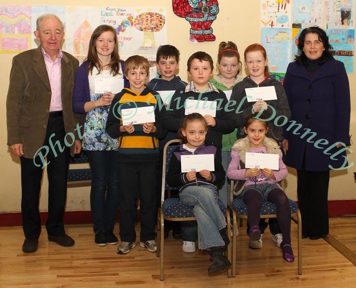 Winners of the Lehinch NS section of the St Colman's (Claremorris) Credit Union Poster Competition 2010, front from left Category A- Caoimhe Hughes, 1st; Tori Morris, 2nd; Middle row Category B: JHarry Delaney, 1st; Mark Kelly, 2nd and  Kayleen Coen, 3rd; At back, Johnny Kirrane, Claremorris Credit Union, with Louise Delaney, 1st Category C; Cathal Owens, 2nd,  Megan McDermott, 3rd and Catherine Owens, (teacher). Photo:Michael Donnelly