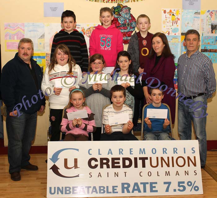Winners of the Mayo Abbey NS section of the St Colman's (Claremorris) Credit Union Poster Competition 2010, front from left Category A- Caoimhe Mannion, 1st; Jack Fallon, 2nd; and David Quinn, 3rd; Middle row Category B:Niamh Mannion, 1st; Shannon Roughneen, 2nd and  Aoife Brennan, 3rd; At back, Micheal Roughneen, (parent); Sylvester Ruane, 1st Category C; Laura Brennan, 2nd, Liamy Rushe, 3rd; Miriam Quinn, (teacher) and John Timothy, Claremorris Credit Union. Photo:Michael Donnelly
