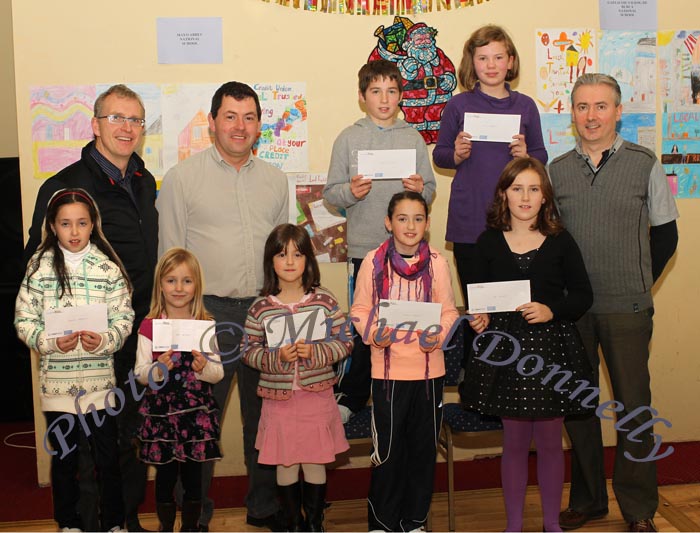 Winners of the Gortskehy NS section of the St Colman's (Claremorris) Credit Union Poster Competition 2010, front from left Rache Hession 1st Cat B, and Amy Hession 3rd Category A Megan Commins 1st Category A; Nicola Hession, 2nd; and Amy Frizzell, 3rd, Category B: At back, Tomas Ruane, Claremorris Credit Union;  
PJ Commins; Patrick Hession 2nd and Orla Beddows 1st Cat C and Padraig Beirne, (teacher). Photo:Michael Donnelly