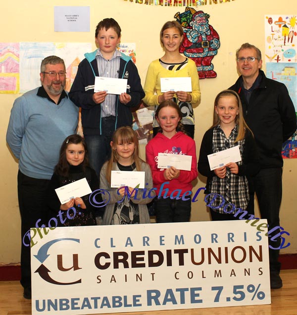 Winners of the  Gaelscoil Uileog De Burca NS section of the St Colman's (Claremorris) Credit Union Poster Competition 2010, front from left Category A- Briona Nic Dhiarmada, 1st; Alanah Nic Donnacha, 2nd;  and in Category B, Briona Finnerty, 2nd and Orla Flanagan 3rd ; At back ; Luke O'Malley, Claremorris Credit Union, Culan Higgins, 1st; and Bernyce Kyra Bormana 2nd, in Category C and Tomas Ruane, Claremorris Credit Union. Photo:Michael Donnelly