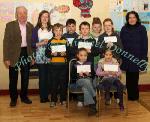 Winners of the Lehinch NS section of the St Colman's (Claremorris) Credit Union Poster Competition 2010, front from left Category A- Caoimhe Hughes, 1st; Tori Morris, 2nd; Middle row Category B: JHarry Delaney, 1st; Mark Kelly, 2nd and  Kayleen Coen, 3rd; At back, Johnny Kirrane, Claremorris Credit Union, with Louise Delaney, 1st Category C; Cathal Owens, 2nd,  Megan McDermott, 3rd and Catherine Owens, (teacher). Photo:Michael Donnelly