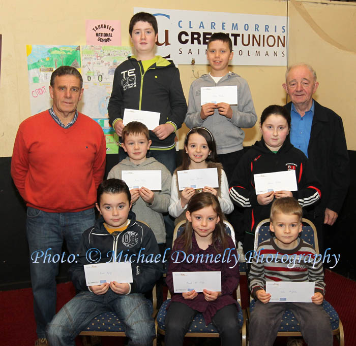 Winners  Ballindine NS section of the Claremorris Credit Union Poster competition 2011 front from left Category A:  Briean Eagney, 1st; Niamh McAuley, 2nd and Aidan Naughton, 3rd;  Middle row Category B: Fenton Kelly, 1st; Anna Sheridan ,2nd; and Emma Corless 3rd; At back with category C: John Timothy, Claremorris CU;James Corless, 1st;   and Aidan Macken, 3rd and John Kirrane, Claremorris Credit Union. Missing was Kaela Dixon 2nd in Category C; Photo: © Michael Donnelly 