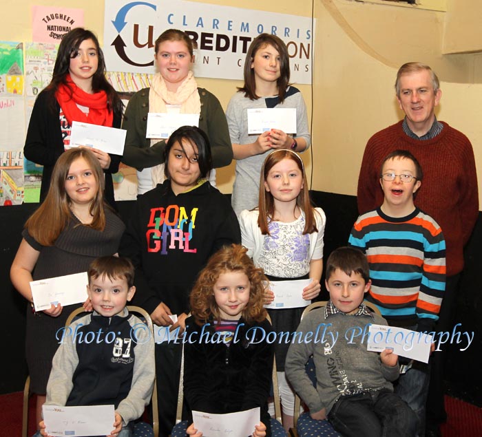 Winners of the Barnacarroll NS section of the Claremorris Credit Union Poster competition 2011 front from left Category A: TJ O'Brien, 1st; Caoimhe Colgan, 2nd and Cathal Bermingham, 3rd;  Middle row Category B: Zoe Jennings, 1st;  Louise Reaney, 2nd; and Niamh Joyce, 3rd; At back  category C: Sinead O'Brien, 1st; Ciara Flatley, 2nd, and Niamh Lusson, 3rd and Seamus Connaughton, Claremorris Credit Union. Photo: © Michael Donnelly