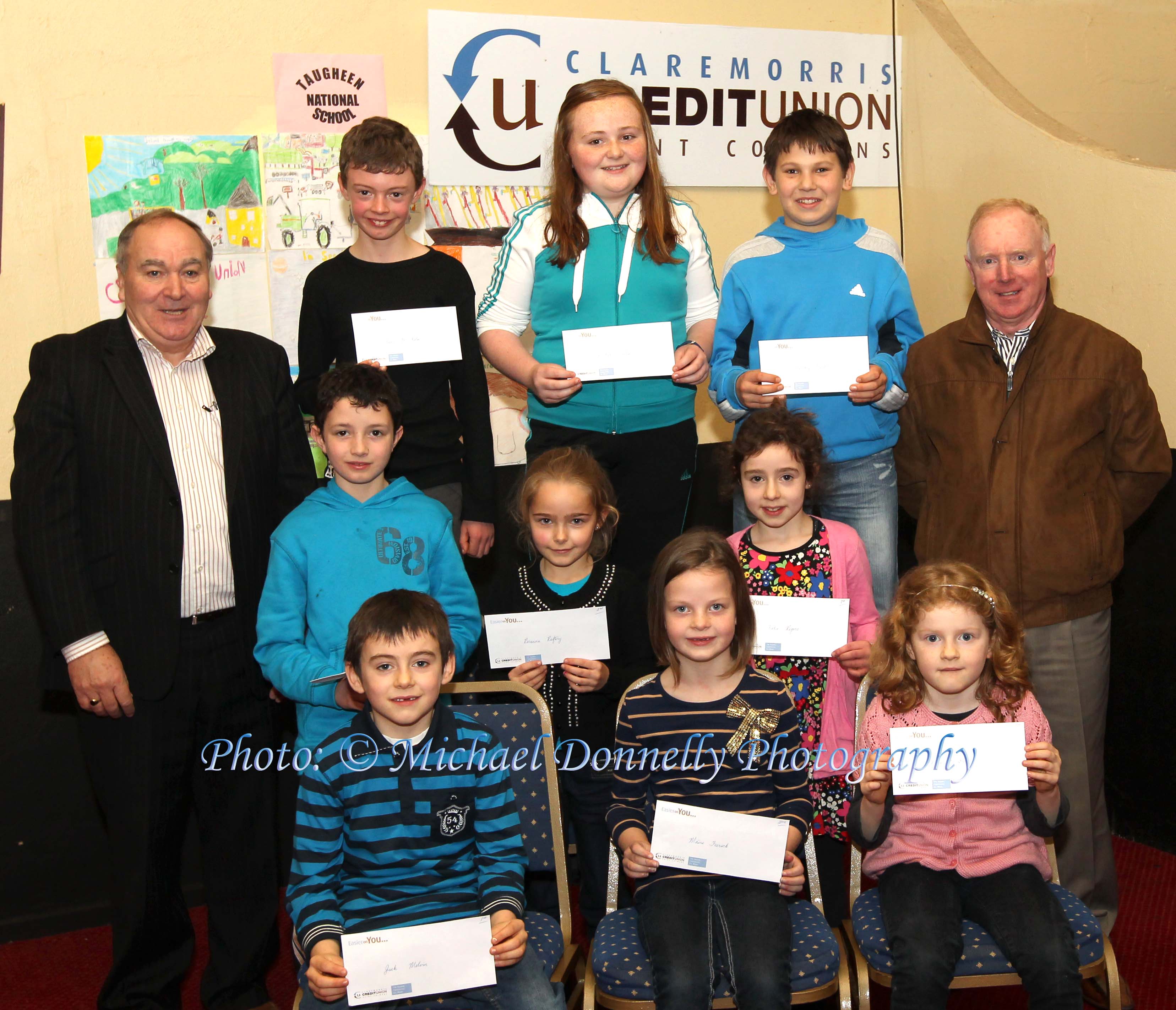 Winners of the Irishtown NS section of the Claremorris Credit Union Poster competition 2011 front from left Category A: Jack Melvin, 1st; Márie Feerick, 2nd and Rhona O'Dea, 3rd;  Middle row Category B: Jason Huane, 1st;  Rosanna Raftery, 2nd; and Katie Rogers, 3rd; At back with category C: Brendan Mellett,  Claremorris Credit Union;  Evan McHolm, 1st; Rachel Fallon, 2nd, and Dmitry Trench, 3rd and Ger Conroy, teacher. Photo: © Michael Donnelly