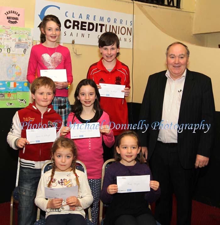 Winners of the Gaelscoil Uileog De Burca NS section of the Claremorris Credit Union Poster competition 2011 front from left Category A: Ruby Phillips, 1st;  Niamh Flanagan, 2nd and  Briain O Breaslain, (missing) was  3rd;  Middle row Category B: Edward O Cabraigh, 1st;  Sorcha Ni Threinfhir (missing) was, 2nd; and Muirgheal Ottowell, 3rd; At back category C: Orlagh Henry, 1st; Evan McDonagh, 2nd,  Matthew Finn (missing), 3rd, and Brendan Mellett Claremorris Credit Union. Photo: © Michael Donnelly Photography
