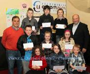 Winners of the Lehinch NS section of the Claremorris Credit Union Poster competition 2011 front from left Category A: Anna Farragher, 1st; Emma Kelly, 2nd and Conor Crane, 3rd;  Middle row Category B: Mark Kelly, 1st;  Stacey McDermott, 2nd; and Niamh Cassidy, 3rd; At back with category C: John Timothy,  Claremorris Credit Union; Megan McDermott, 1st; Cathal Owens, 2nd, and Harry Delaney, 3rd and Ger McHugh, teacher. Photo: © Michael Donnelly Photography