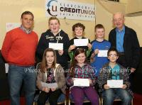 Winners of the Mayo Abbey NS section of the Claremorris Credit Union Poster competition 2011 front from left Category A: Clara Kenna, 1st; Missing were Jarlath Judge, 2nd and Michaela Forde, 3rd;  Category B: Alisha Conway, (missing) 1st;  Aoife Duggan, 2nd; and Adam Oates, 3rd; At back with category C: John Timothy, Claremorris Credit Union; Niamh Mannion,  1st; Colin Ruane, 2nd, and Eoin Duggan, 3rd and John Kirran, Claremorris Credit Union. Photo: © Michael Donnelly Photography