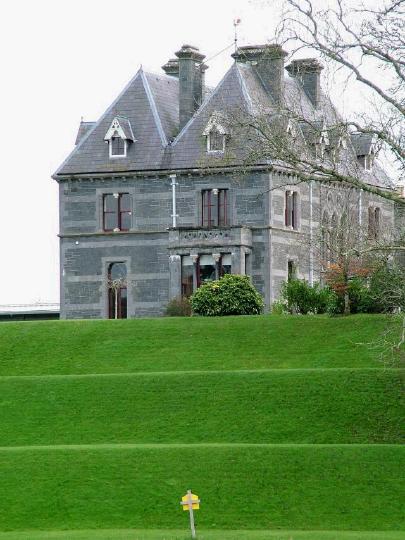 Turlough House with its stepped lawns leading down to the lake.