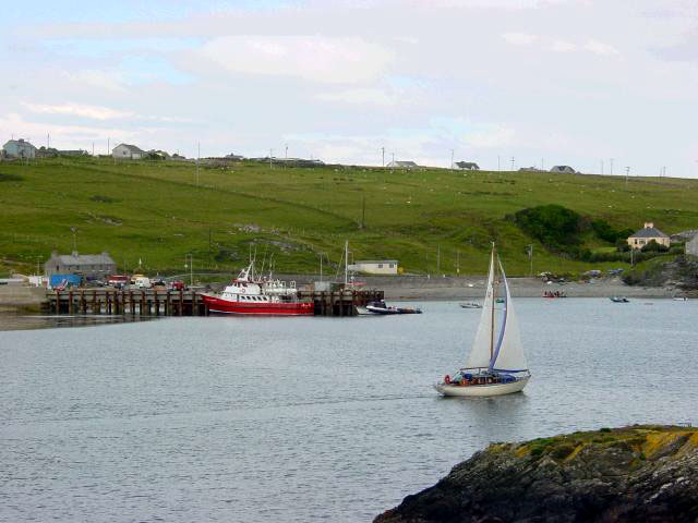 The main pier viewed from across the harbour at Cromwell's Fort. The island has a good few hotels, guesthouses, self-catering accommodation and some excellent restaurants. It is famous for its traditional Irish music in the pubs in the evenings.