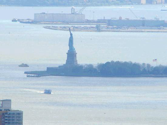 In the blue hazy distance Liberty can be seen holding her torch high