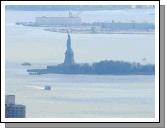 In the blue hazy distance Liberty can be seen holding her torch high