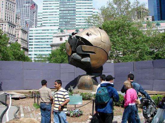 The damaged sphere sculpture that once sat outside the Twin Towers.