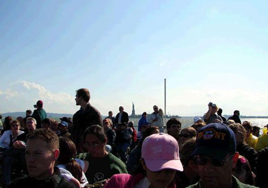 The Statue of Liberty is visible in the background