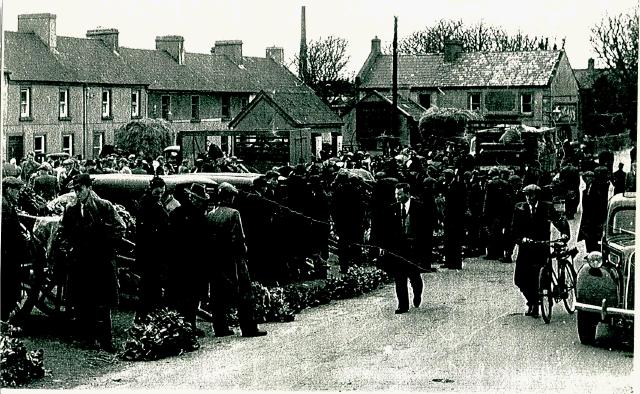 Market Square, Castlebar. Showing the weighing scales and Forresters Hall. What year from Aidan Brett